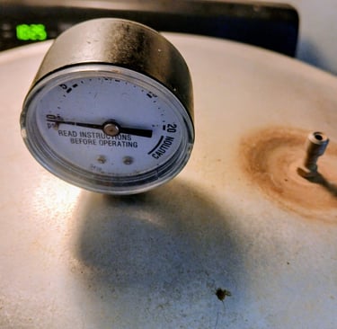 weight off the pressure cooker to let steam escape for burping