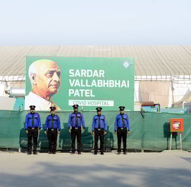 a group of police officers standing in front of a large billboard