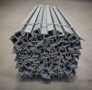 “Front view of mixed steel materials including angles, channels, beams, and pipes for export buyers”