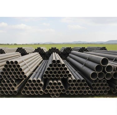 Bulk packaging of round steel pipes ready for export shipment.