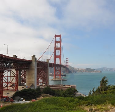 a bridge spanning the golden gate bridge over looking the water