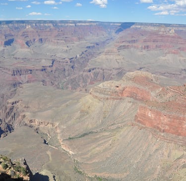 on a cliff overlooking the grand canyon