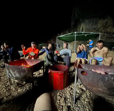 Chilling by the camp fire in Hang En cave, ke bang national park Vietnam