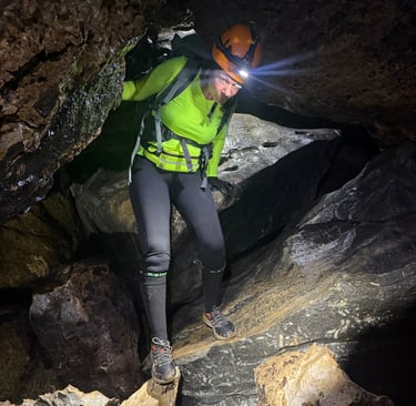 Tracey Billington climbing through a boulder field in Hang Son Doong Cave to get to doline 1