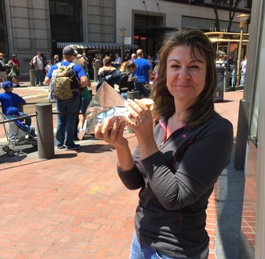 Tracey is holding a hot dog