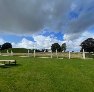 posts that represent an ancient ship surrounding the Burial mound at the centre of jelling, Denmark
