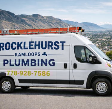 White Brocklehurst Kamloops Plumbing van parked with mountains, clear branding, phone number visible