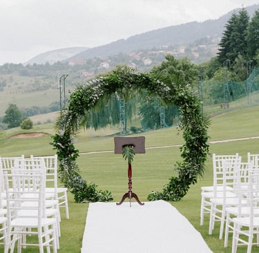 a wedding ceremony with a white aisle runner and a white aisle runner