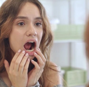 a women opening mouth to see decay teeth