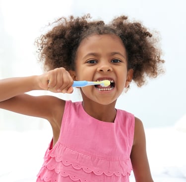 a child brushing teeth 