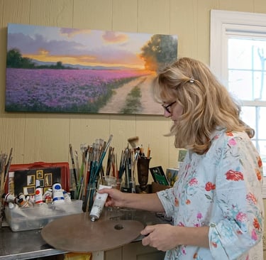 artist working in her studion on traditional, impressionistic oil painting