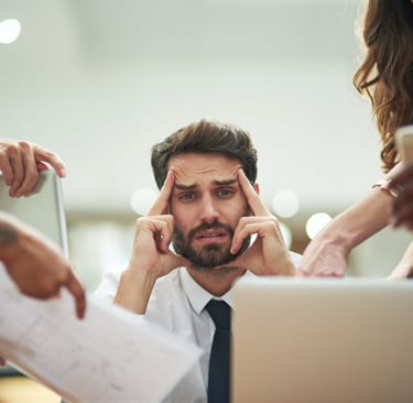 Frustrated IT manager overwhelmed by scaling challenges