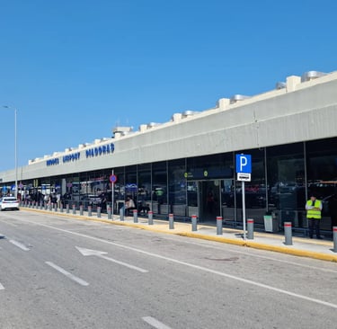 The exterior terminal building of Rhodes Airport Diagoras in Greece on a sunny day.