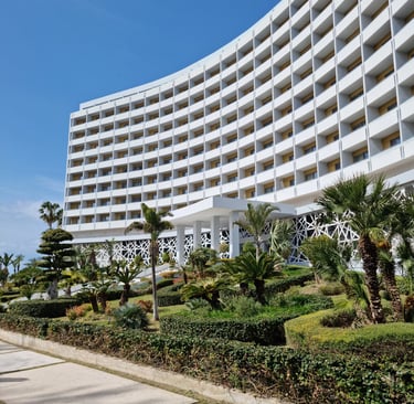 a large white building with a large white building in the background