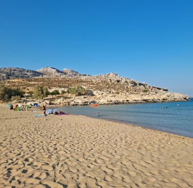 a beach with people on a sunny day