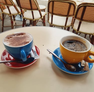 two cups of coffee and a sugar