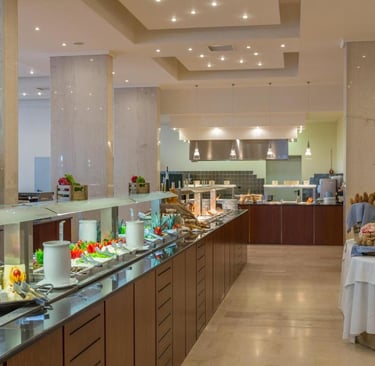 Luxury hotel breakfast buffet featuring a variety of fresh food, cheeses, and breads.