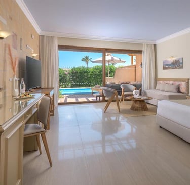 Luxury hotel room with a private pool view, featuring modern furniture and an elegant terrace.