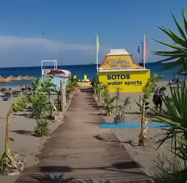 sandy beach in greece with sotos water sports beach house in faliraki