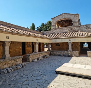 Stone courtyard and ancient architecture of the Filerimos Monastery in Rhodes, Greece.