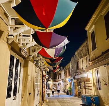 colorful umbrellas hanging upside down in rhodes old town