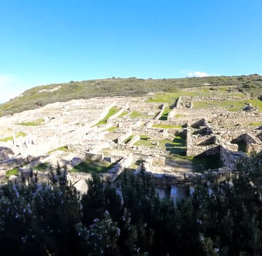 a view from a mountain with a view on Ancient Kamiros in Rhodes Greece