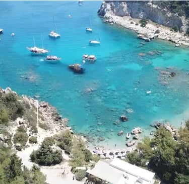 Anthony Quinn Bay Rhodes with emerald water and few boats