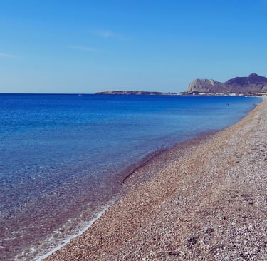 a beach with a boat in the water