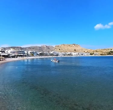 a beach with a boat in the water