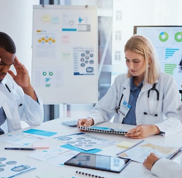 overworked healthcare professionals thinking and team of doctors in meeting