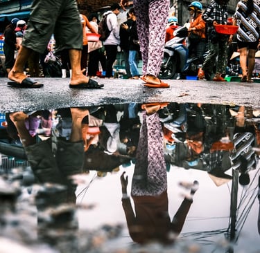 Reflection of Vietnamese lady on the street