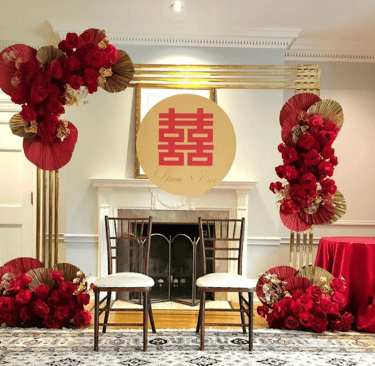 Chinese Tea Ceremony gold chrome backdrop with red roses and a double happiness sign for rent