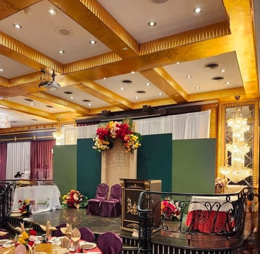 Elegant Chinese tea ceremony stage setup featuring layered green backdrop panels, a traditional wood