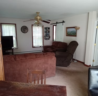 family room with barn door to foyer