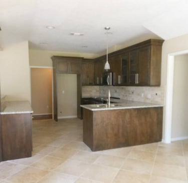 a kitchen with a large kitchen penensula