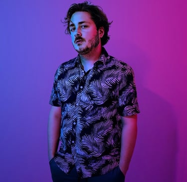 a man with a beard and a black shirt