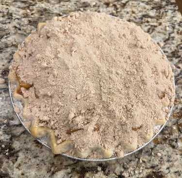 peach pie with bourbon reduction and crumb topping