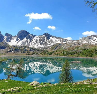 Alps mountain lake with mountains and snow