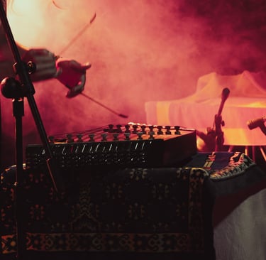 Libero Reina spinning a Persian Santoor in a dark room