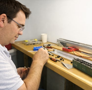 Person detailing model at Arizona Model Railroad Club