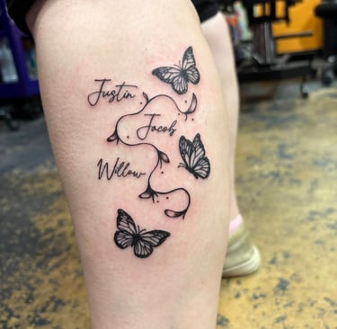 a tattoo of a butterfly tattoo on a woman's leg