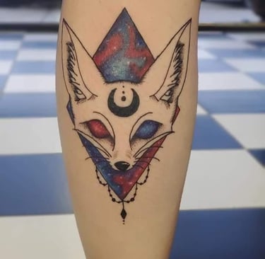 a tattoo style fox head with a triangle jewel chains on it
