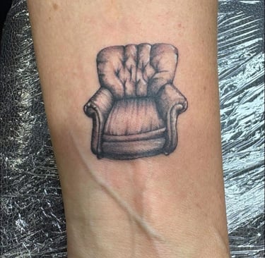 a tattoo of a chair tattoo on arm