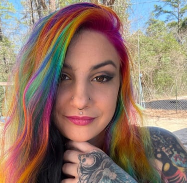 Tattoo artist in Pineville Louisiana that is trending on Tik Tok very talented with colorful hair