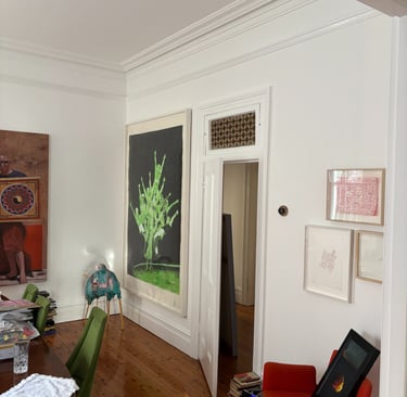 A gallery style home installation with thoughtful placement of our clien'ts artworks