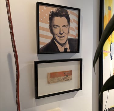 A couple of Andy Warhols double hung above a stairwell
