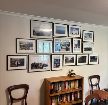 a gallery style art hanging with a cluster of family photographs