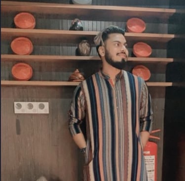 a man in a striped shirt and a red and white striped shirt