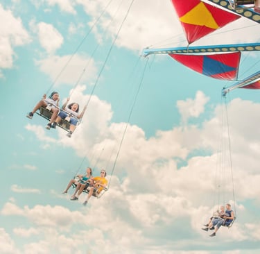 a group of people riding on a swing line