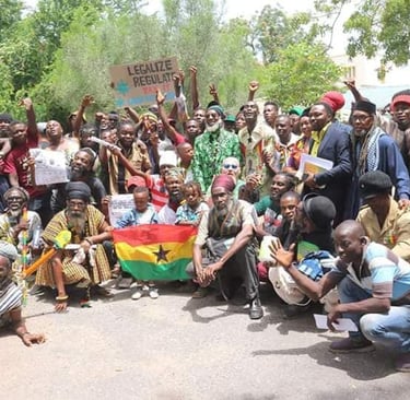 a group of people standing around a man holding a flag